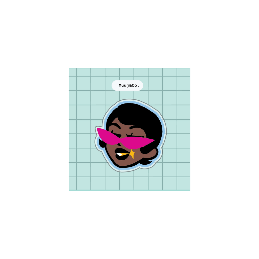 A die-cut sticker featuring a stylized cartoon face with dark skin, black hair, and bright pink sunglasses, set against a light blue grid background. 